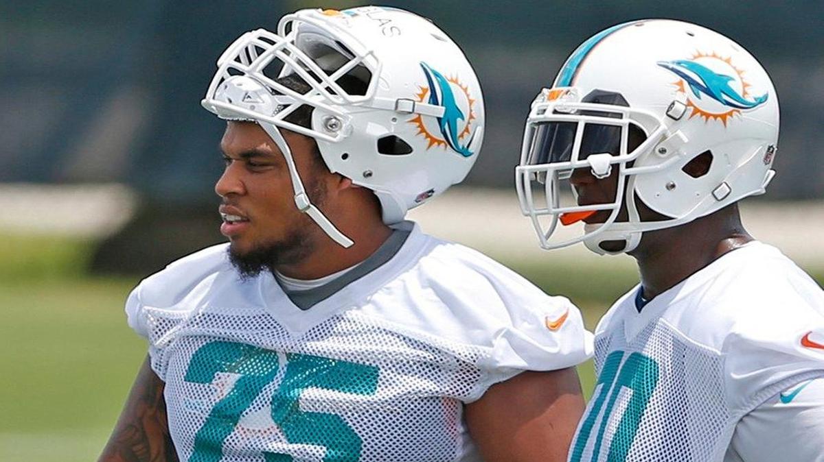 
The progress of rookie guard Jamil Douglas (75), shown with right tackle Ja'Wuan James, could determine whether the Dolphins sign free agent Evan Mathis. 

