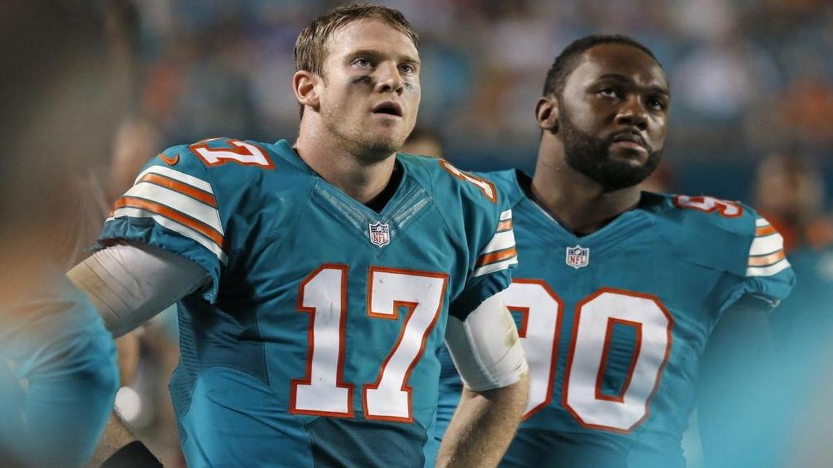 The return of Earl Mitchell, right, strengthens an already-potent Dolphins defensive line.