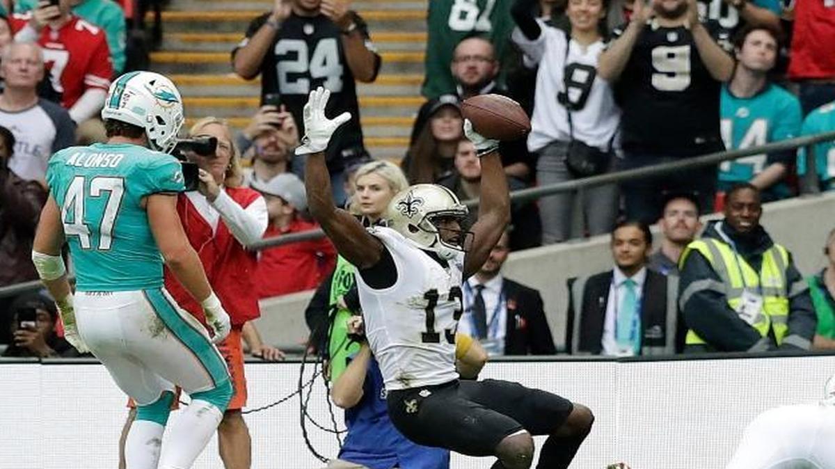 New Orleans Saints wide receiver Michael Thomas (13) celebrates after scoring a touchdown during the second half of an NFL football game against the Miami Dolphins at Wembley Stadium in London, Sunday Oct. 1, 2017.
