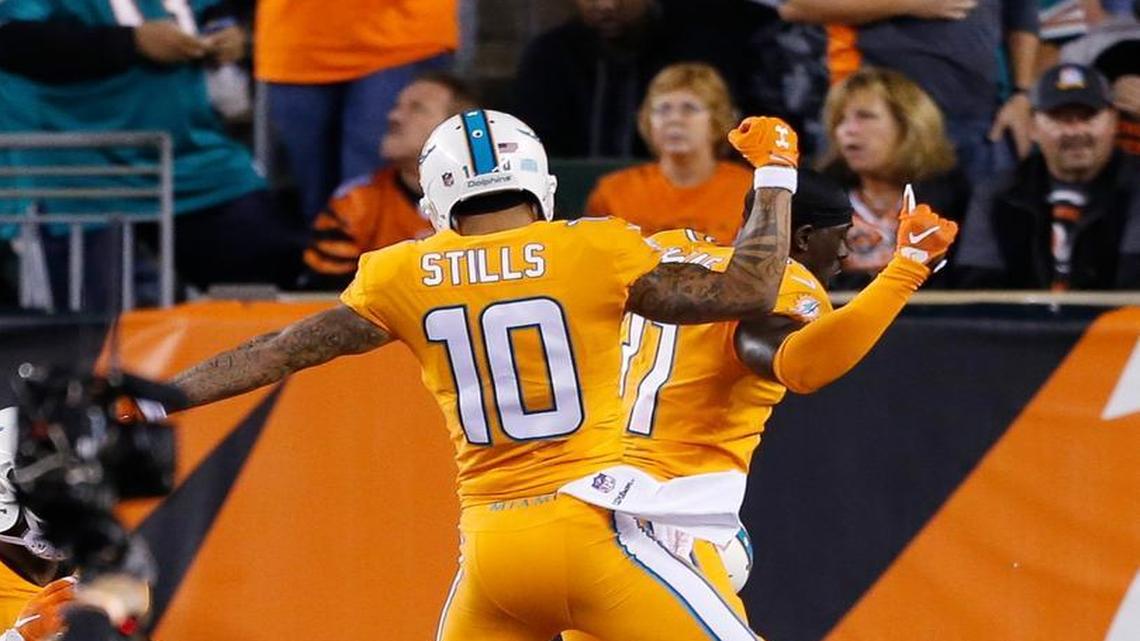 Miami Dolphins wide receiver Kenny Stills (10) celebrates his touchdown with free safety Michael Thomas (31) in the first half of an NFL football game against the Cincinnati Bengals, Thurs., Sept. 29, 2016, in Cincinnati.