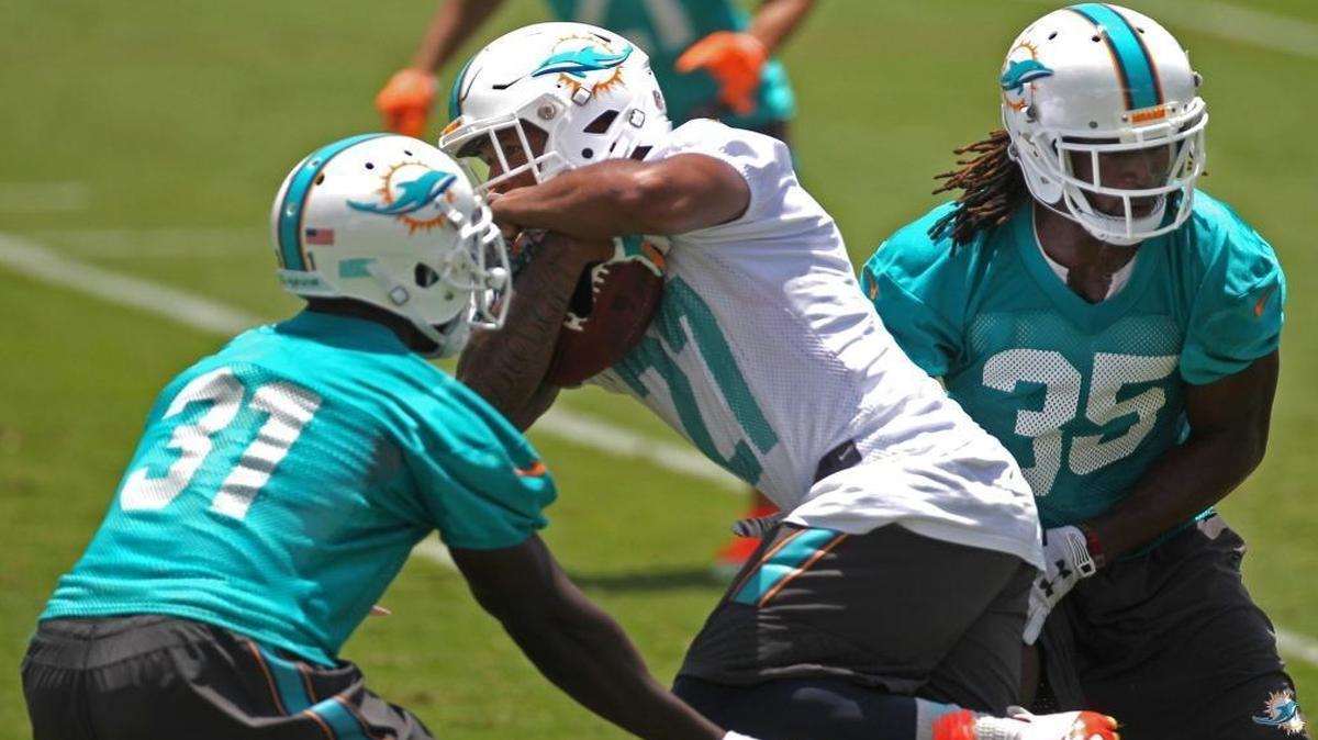 Walt Aikens, right, did not play Sunday because he was late for a meeting.