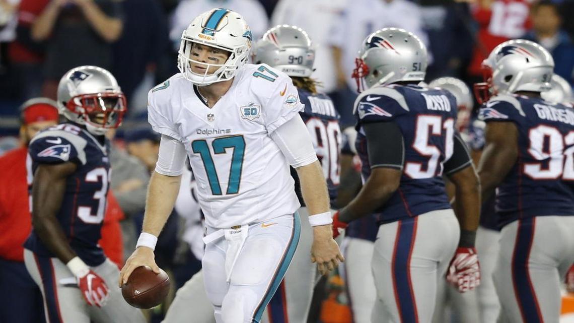 The New England Patriots celebrate after Miami Dolphins quarterback Ryan Tannehill is sacked in the fourth quarter at Gillette Stadium in Foxborough, Massachusetts on Thursday, October 29, 2015.