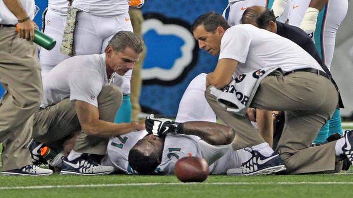 
Miami Dolphins offensive lineman Branden Albert lays on the field injured in the second quarter during the team’s game against the Detroit Lions at Ford Field in Detroit on Nov. 9, 2014.
