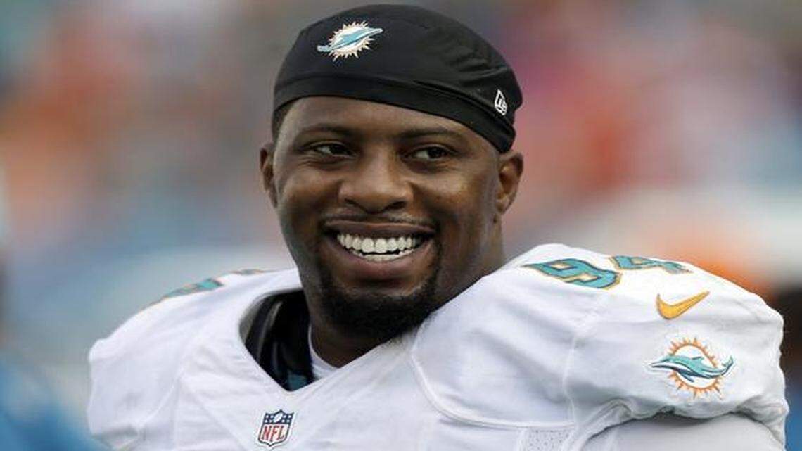 
Miami Dolphins defensive tackle Randy Starks smiles on the sideline during a game against the Kansas City Chiefs, Sunday, Sept. 21, 2014, in Miami Gardens, Fla. 
