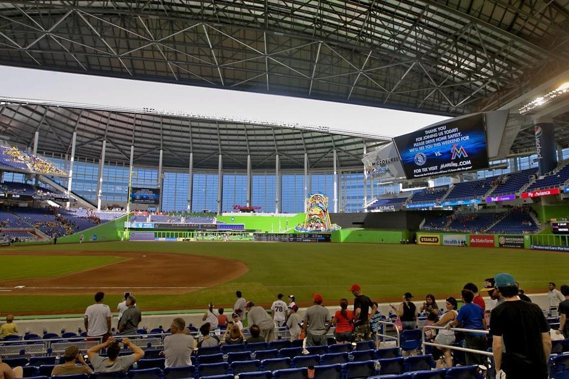 Fans watch the roof open after the game between the Miami Marlins and the Atlanta Braves at Marlins Park on July 25, 2012.