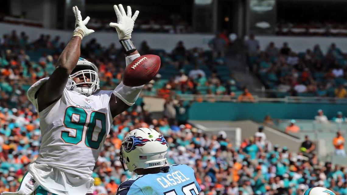Miami Dolphins Charles Harris (90) blocks Tennessee Titans quarterback Matt Cassel (16) throw in the second quarter at Hard Rock Stadium in Miami Gardens, Florida, October 8, 2017.
