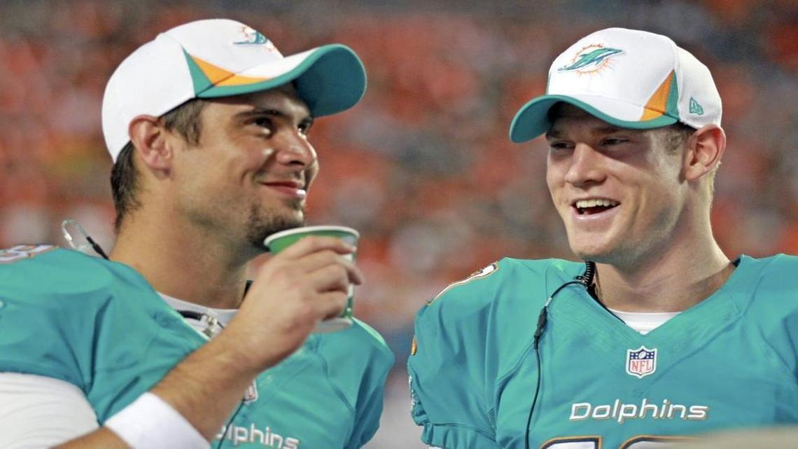 Matt Moore, left, has re-signed with the Dolphins and will back up Ryan Tannehill for a fifth season in a row this fall.