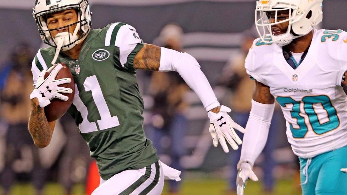 New York Jets receiver Robby Anderson gets away from Miami cornerback Bacarri Rambo in the Dolphins win at the Meadowlands on December 17, 2016.