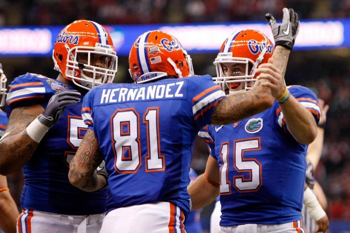 Aaron Hernandez celebrates with his teammates Mike Pouncey and Tim Tebow after scoring a touchdown in the first quarter against the Cincinnati Bearcats during the Allstate Sugar Bowl at the Louisana Superdome on January 1, 2010 in New Orleans, Louisiana. Mike Pouncey said he was ‘surprised’ by the revelation that Aaron Hernandez had a severe case of CTE, but that ‘it’s real.’