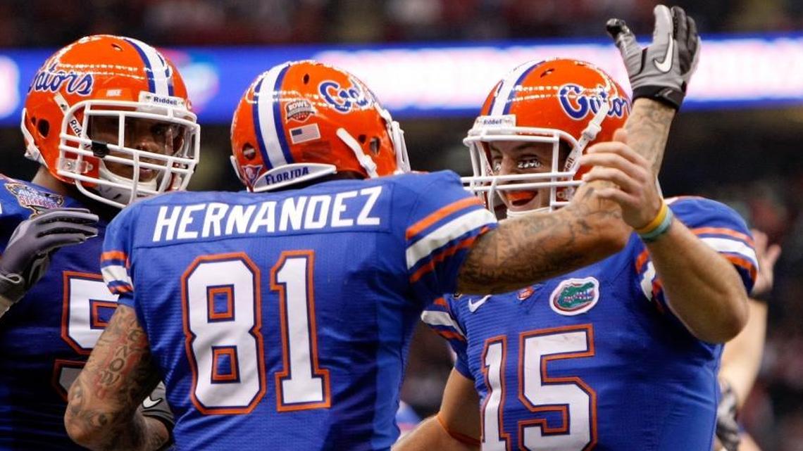 Aaron Hernandez celebrates with his teammates Mike Pouncey and Tim Tebow after scoring a touchdown in the first quarter against the Cincinnati Bearcats during the Allstate Sugar Bowl at the Louisana Superdome on January 1, 2010 in New Orleans, Louisiana. Mike Pouncey said he was ‘surprised’ by the revelation that Aaron Hernandez had a severe case of CTE, but that ‘it’s real.’