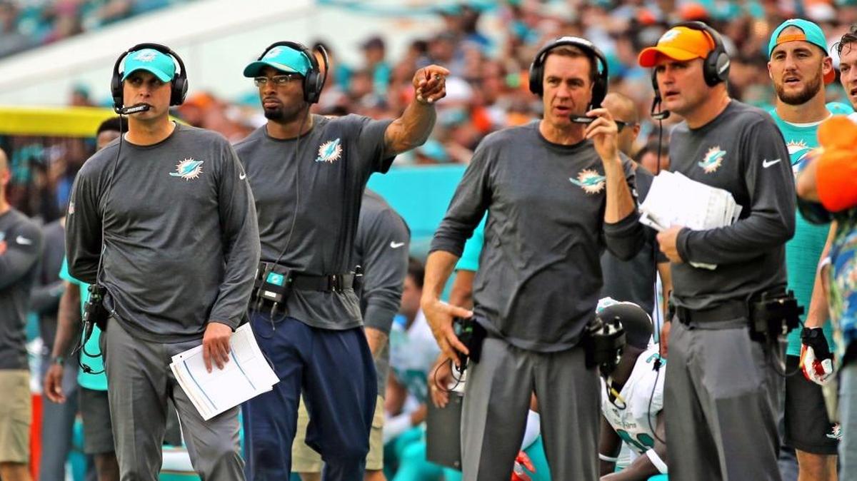 Miami Dolphins coach Adam Gase with his coaching staff on the field as they play the Tennessee Titans at Hard Rock Stadium in Miami Gardens, Florida, October 8, 2017.