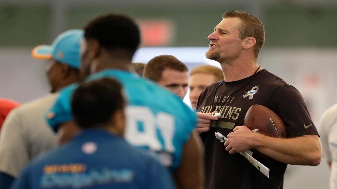 
Miami Dolphins interim coach Dan Campbell gives instructions to the players during NFL football practice, Wednesday, Oct. 7, 2015, in Davie, Fla. 
