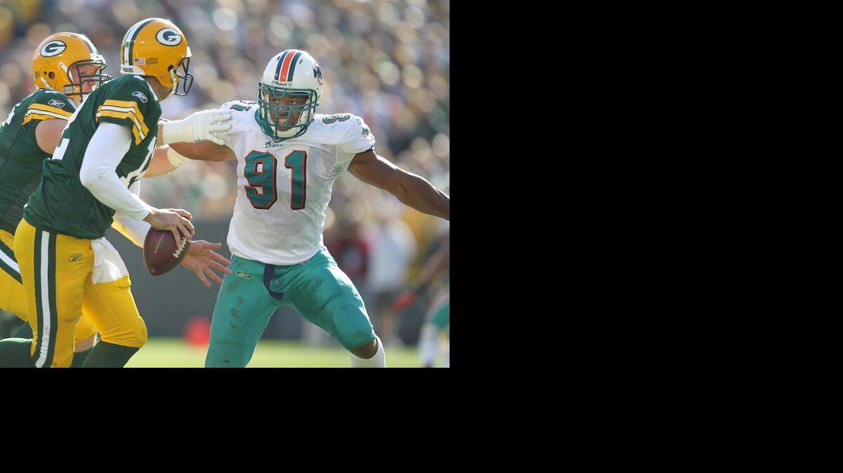 
Miami Dolphins’ Cameron Wake pressures Green Bay quarterback Aaron Rodgers at Lambeau Field on Oct. 17, 2010.
