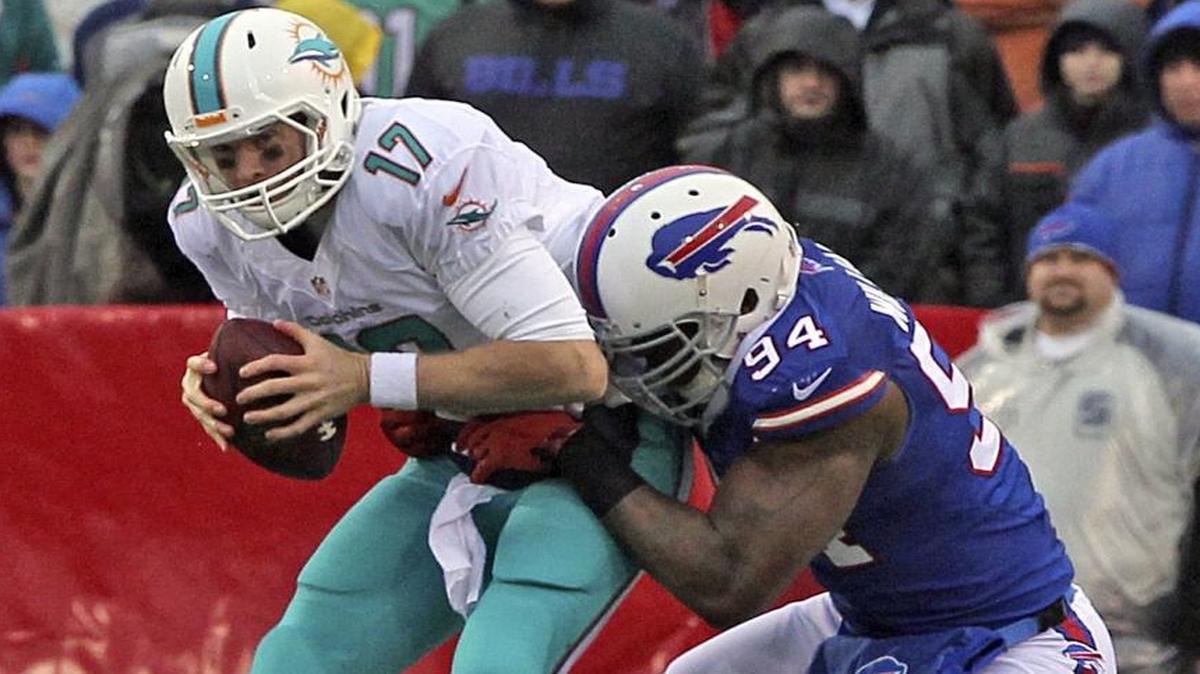 Mario Williams, shown sacking Ryan Tannehill, has been a Miami Dolphins thorn over the years. Now, the Dolphins hope he can do the same to opponents.