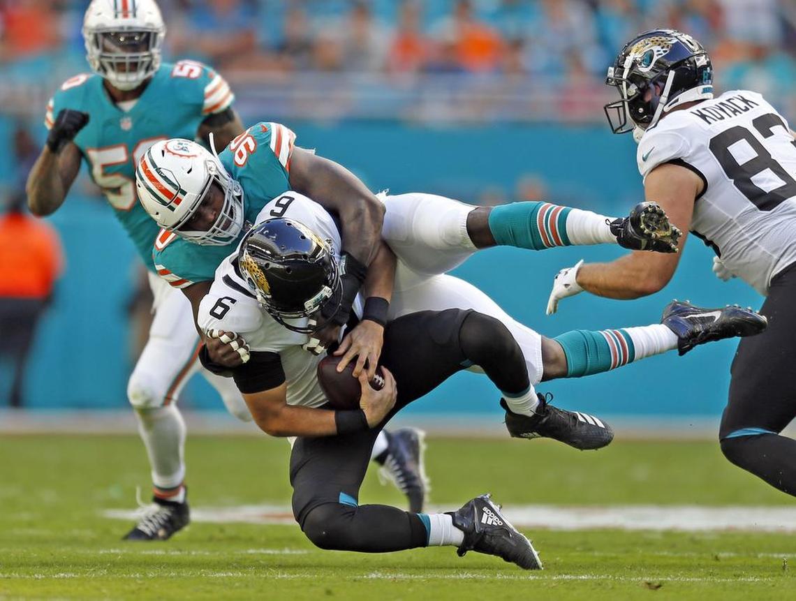 Miami Dolphins defensive end Charles Harris (90) sacks Jacksonville Jaguars quarterback Cody Kessler (6) during a game on Dec. 23. Harris has three sacks in 27 NFL games.