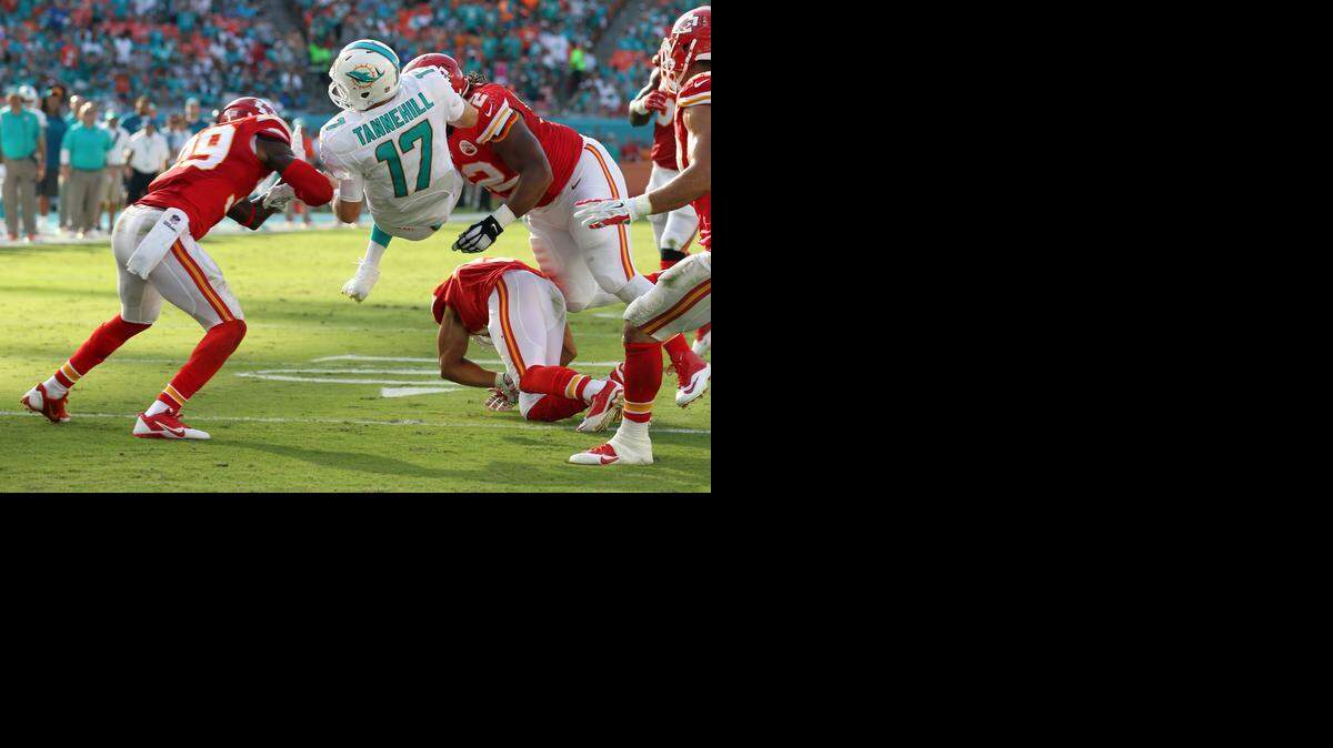 
Miami Dolphins quarterback Ryan Tannehill gets squeezed between Kansas City Chiefs defenders Husain Abdullah and Dontari Poe at the end of the second quarter at Sun Life Stadium in Miami Gardens, Fla., on Sunday, Sept. 21, 2014. 
