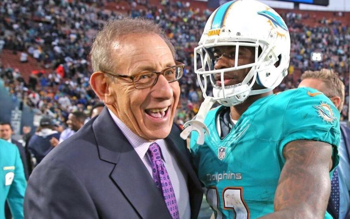 Stephen Ross, shown with Dolphins receiver DeVante Parker, has had plenty to smile about lately.