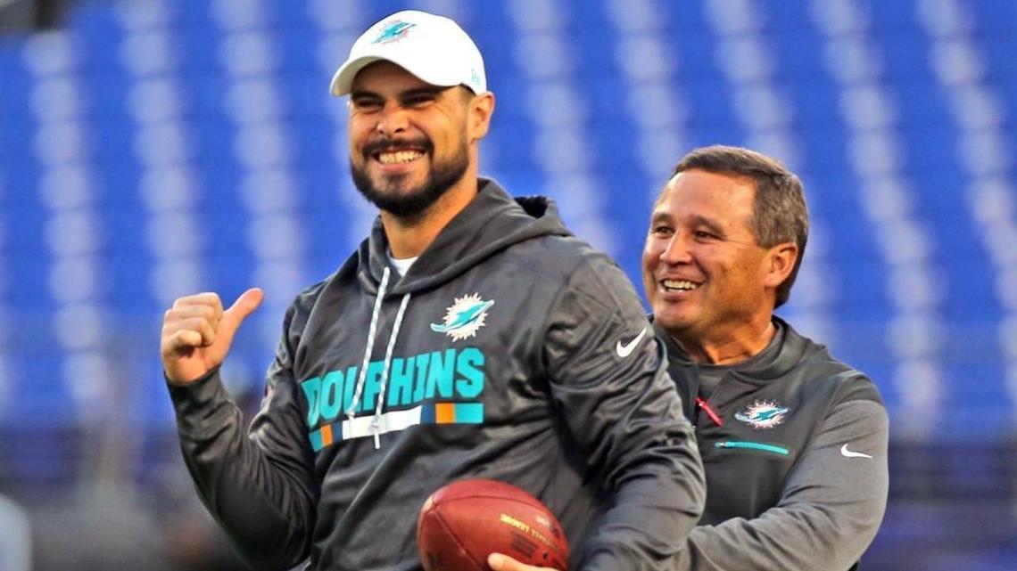 Clyde Christensen, right, shown with quarterback Matt Moore, says the Dolphins have lost their identity.