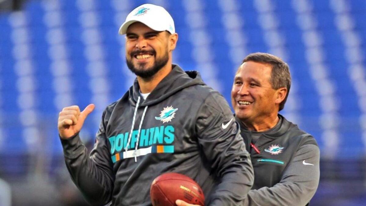 Clyde Christensen, right, shown with quarterback Matt Moore, says the Dolphins have lost their identity.