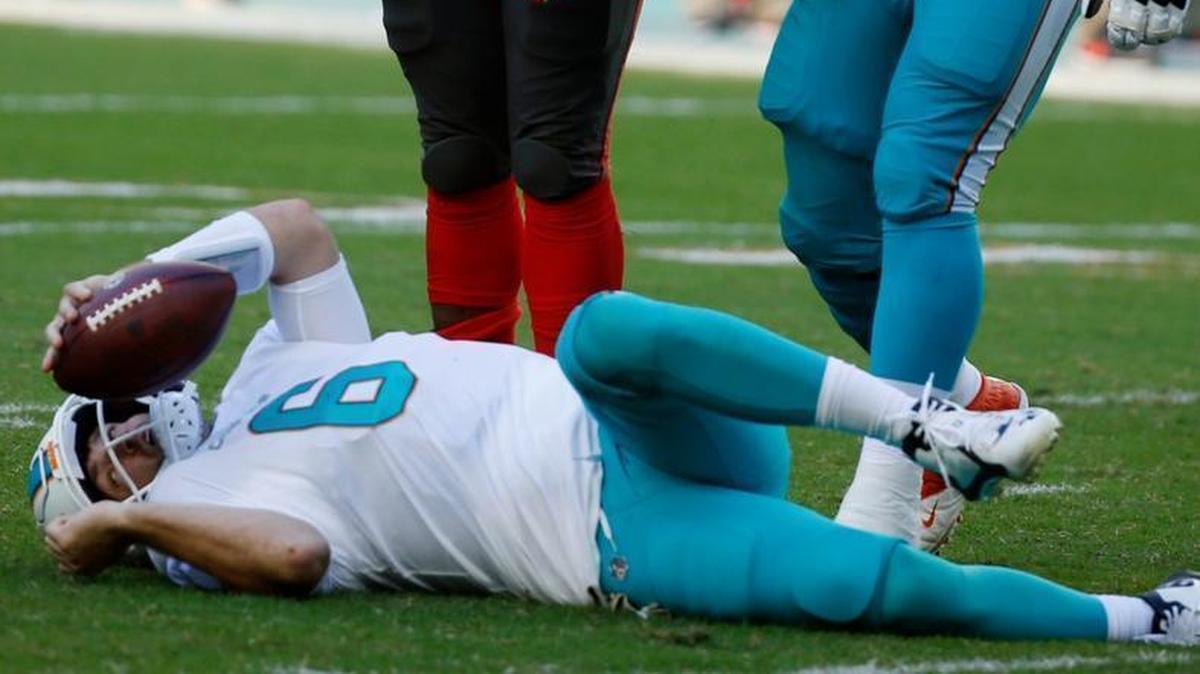Miami Dolphins quarterback Jay Cutler (6) takes his time to get up after he was sacked during the first half against Tampa Bay on Sunday. Cutler later left with a concussion.