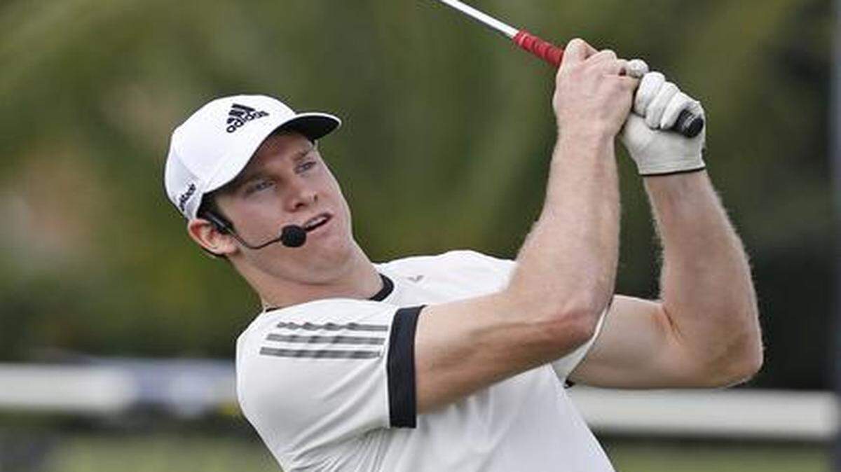 
Dolphins quarterback Ryan Tannehill hits a golf shot during the Adidas Skills Challenge event that pitted PGA pros against Adidas athletes in soccer, basketball, football, track and golf on Tuesday, March 3, 2015 at Trump National in Doral.
