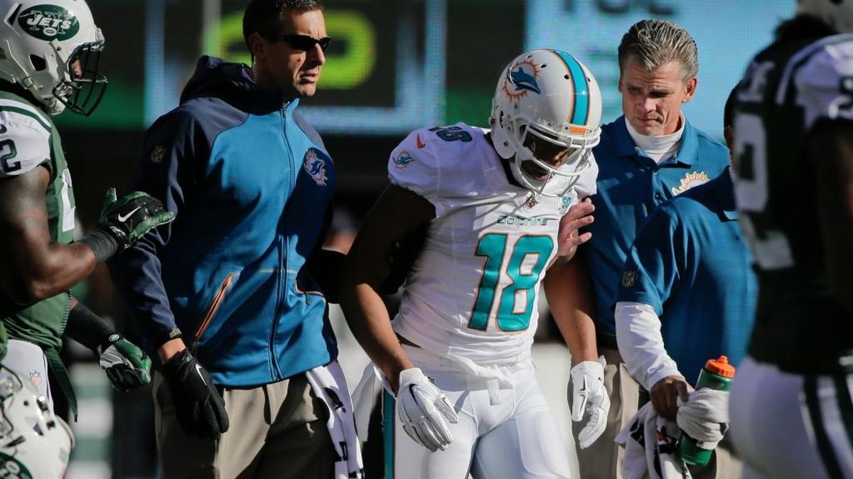 Miami Dolphins wide receiver Rishard Matthews is helped off the field after being hurt on a play during the first half against the New York Jets on Sunday, Nov. 29, 2015, in East Rutherford, N.J.