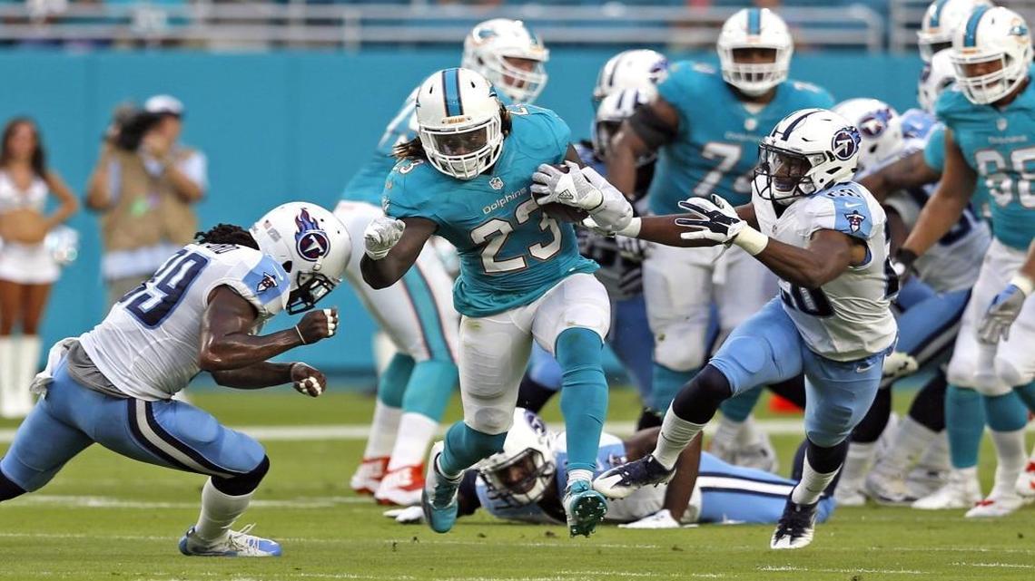 Miami Dolphins running back Jay Ajayi, who was reportedly upset after Arian Foster beat him out for the starting job, was left at home by head coach Adam Gase for the season opener against the Seattle Seahawks.