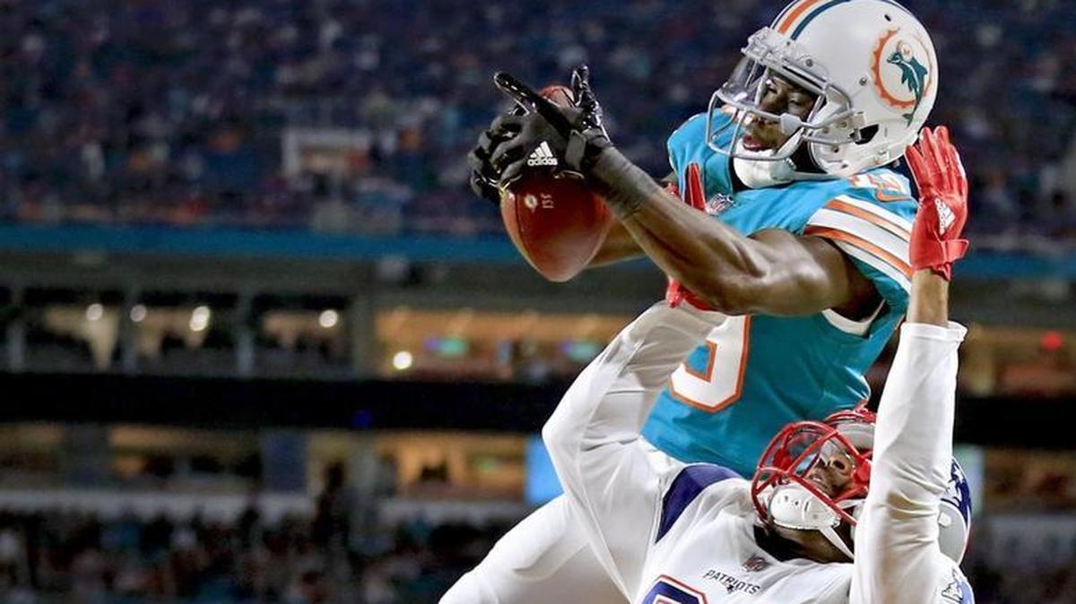 Miami Dolphins wide receiver Jakeem Grant (19) catches a third-quarter touchdown over Malcolm Butler Monday.