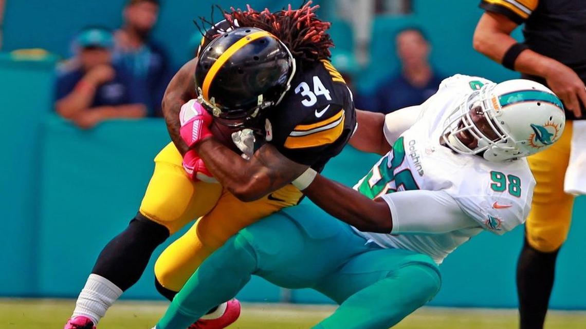 Jason Jones, right, is back with the team after serving a two-week suspension.