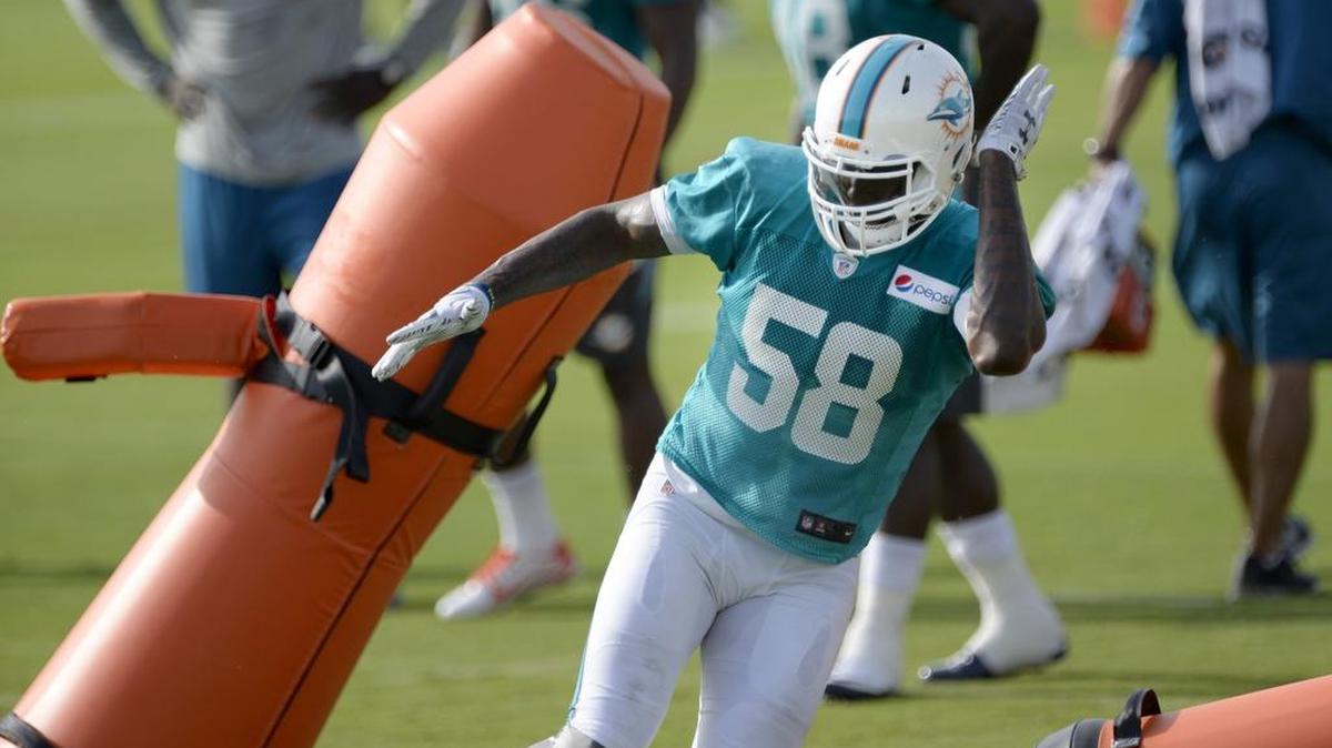 
Linebacker Chris McCain works on drills during the second day of Miami Dolphins training camp Friday, July 31, 2015 in Davie. 
