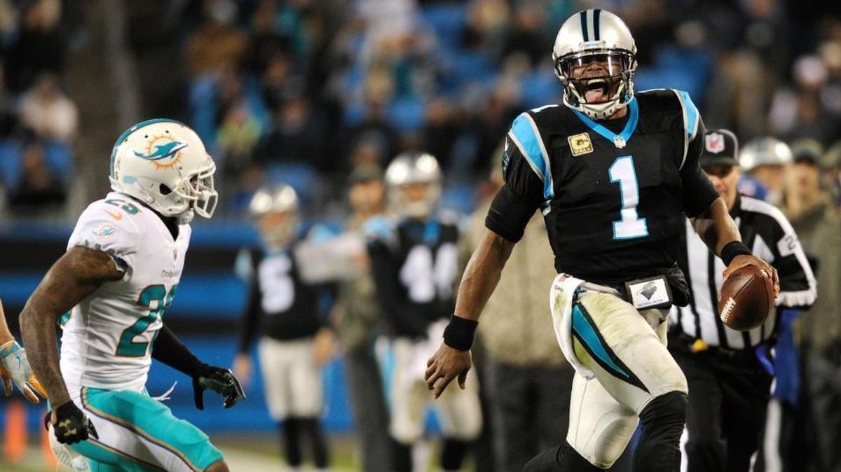 Carolina Panthers' Cam Newton (1) runs past Miami Dolphins' Xavien Howard (25) in the second half of an NFL football game in Charlotte, N.C., Mon., Nov. 13, 2017.