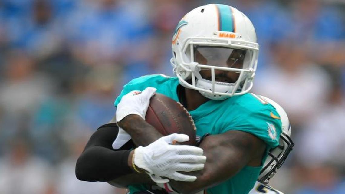 Miami Dolphins wide receiver Jarvis Landry hauls in a pass above Los Angeles Chargers strong safety Dexter McCoil Sunday.