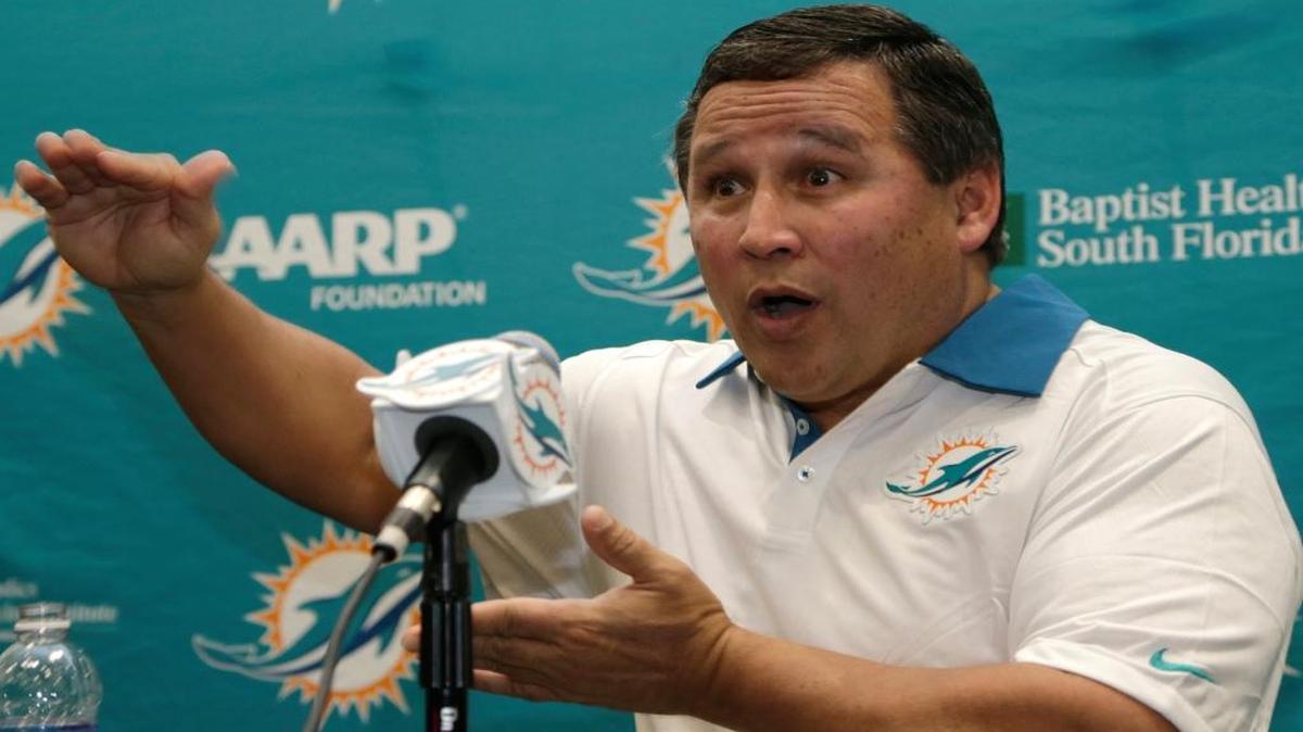 New Miami Dolphins offensive coordinator Clyde Christensen responds to a question during a news conference Thursday, Jan. 28, 2016, in Davie, Fla.