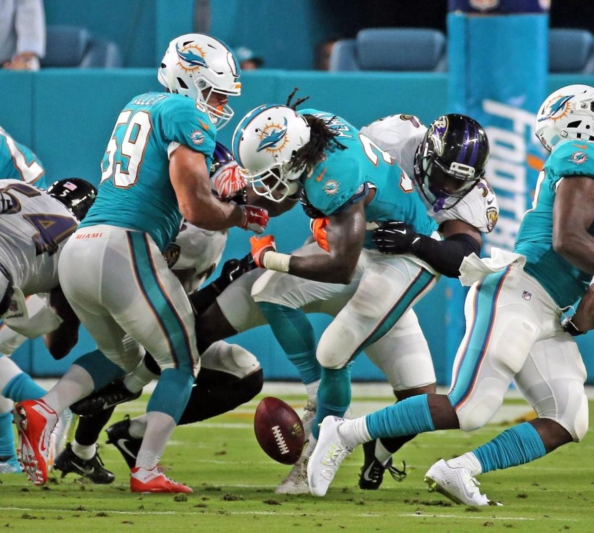 Dolphins Senorise Perry (34) fumbles a second quarter kick off return as the Miami Dolphins play the Baltimore Ravens in their second preseason game at Hard Rock Stadium in Miami Gardens, FL, Aug. 17, 2017.