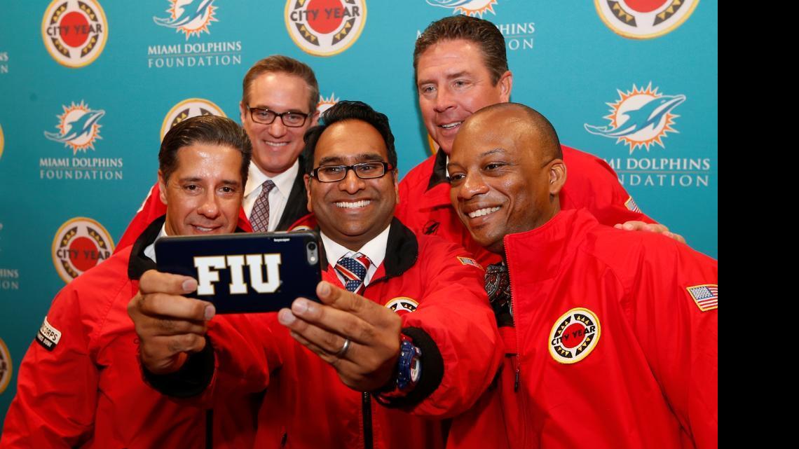 
FIU's Vice President for Engagement Saif Ishoof takes a selfie with from left: Schools Superintendent Alberto Carvallho; Dolphin's President and CEO Tom Garfinkel; Dan Marino; and Miami Gardens Mayor Oliver Gilbert. Miami Dolphins Announce $1 Million Partnership with City Year Miami on Tuesday, April 28, 2015 at Norland High School in Miami Gardens. Through the educational pillar of their foundation, the Dolphins partner with public schools to help students through graduation. City Year is an education-focused organization that partners with high need public schools across the country. Teams of 17 to 24 year old members are there to support students by focusing on attendance, behavior and course performance through in-class support, tutoring, mentoring and after school programs.
