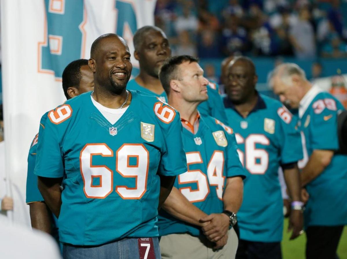 Former Miami Dolphins player Keith Sims (69) is shown during the Dolphins All-Time 50th Anniversary Team ceremony during half time at an NFL football game against the New York Giants, Monday, Dec. 14, 2015, in Miami Gardens.