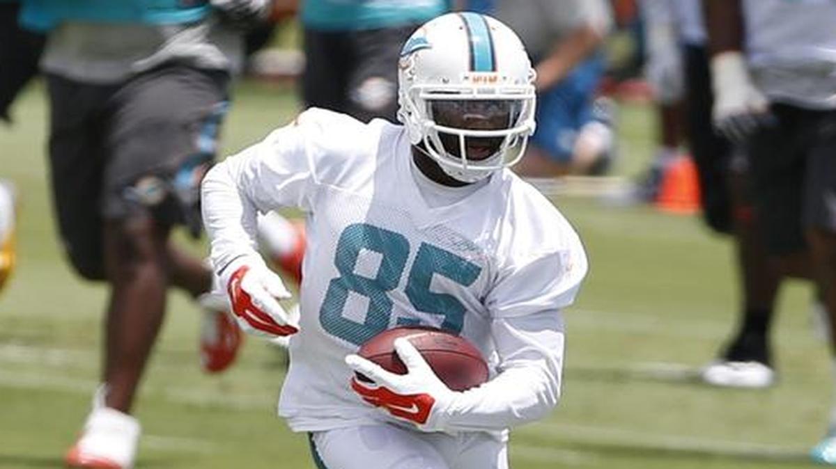 
Greg Jennings, right, has impressed Dolphins quarterback Ryan Tannehill in offseaon workouts.
