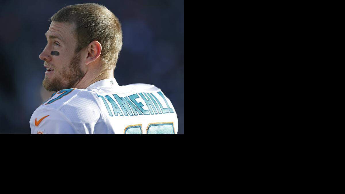 
Miami Dolphins quarterback Ryan Tannehill (17) looks on from the sidelines as the New England Patriots host the Miami Dolphins at Gillette Stadium on Sunday, Dec. 14, 2014
