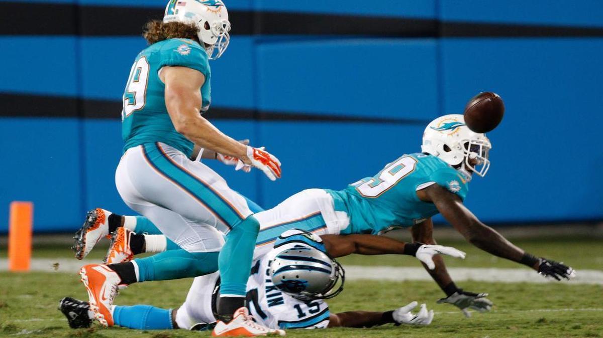 

Zach Vigil, left, is an undrafted rookie out of Utah State who played middle linebacker for Miami against Washington.

