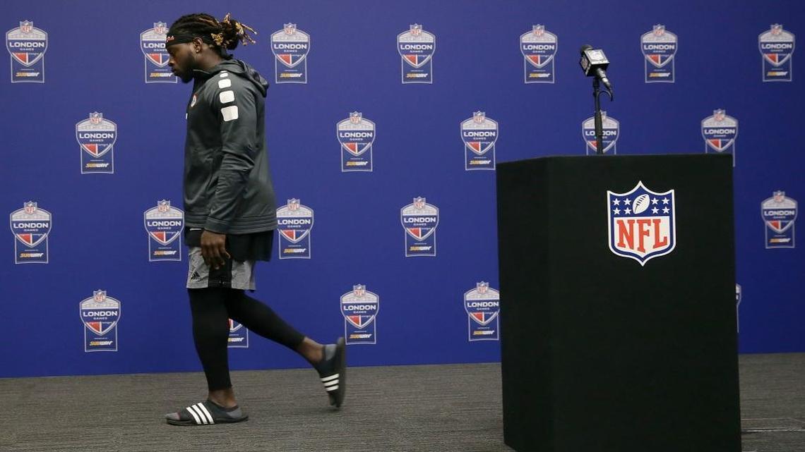 Miami Dolphins running back Jay Ajayi leaves the stage after speaking at a news conference after an NFL football game against the New Orleans Saints at Wembley Stadium in London, Sunday Oct. 1, 2017. The Saints won 20-0.