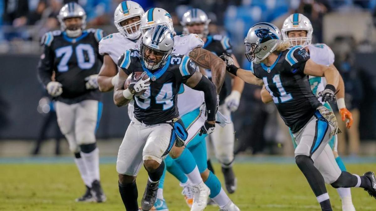 Carolina Panthers' Cameron Artis-Payne (34) finds some open running room against the Miami Dolphins' defense during the second half of the Monday night game on Nov. 13, 2017.