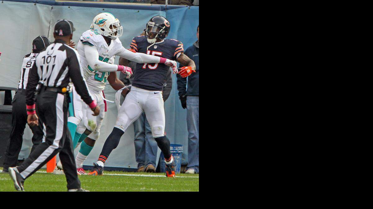 
Miami Dolphins linebacker Chris McCain gets in a shoving match with Chicago Bears receiver Brandon Marshall in the final seconds of the fourth quarter after Marshall drops a pass in the end zone at Soldier Field in Chicago, Illinois, on Sunday, Oct. 19, 2014.
