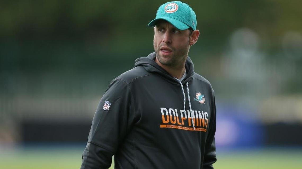 Miami Dolphins head coach Adam Gase looks across the field during a training session at Allianz Park in London Friday.