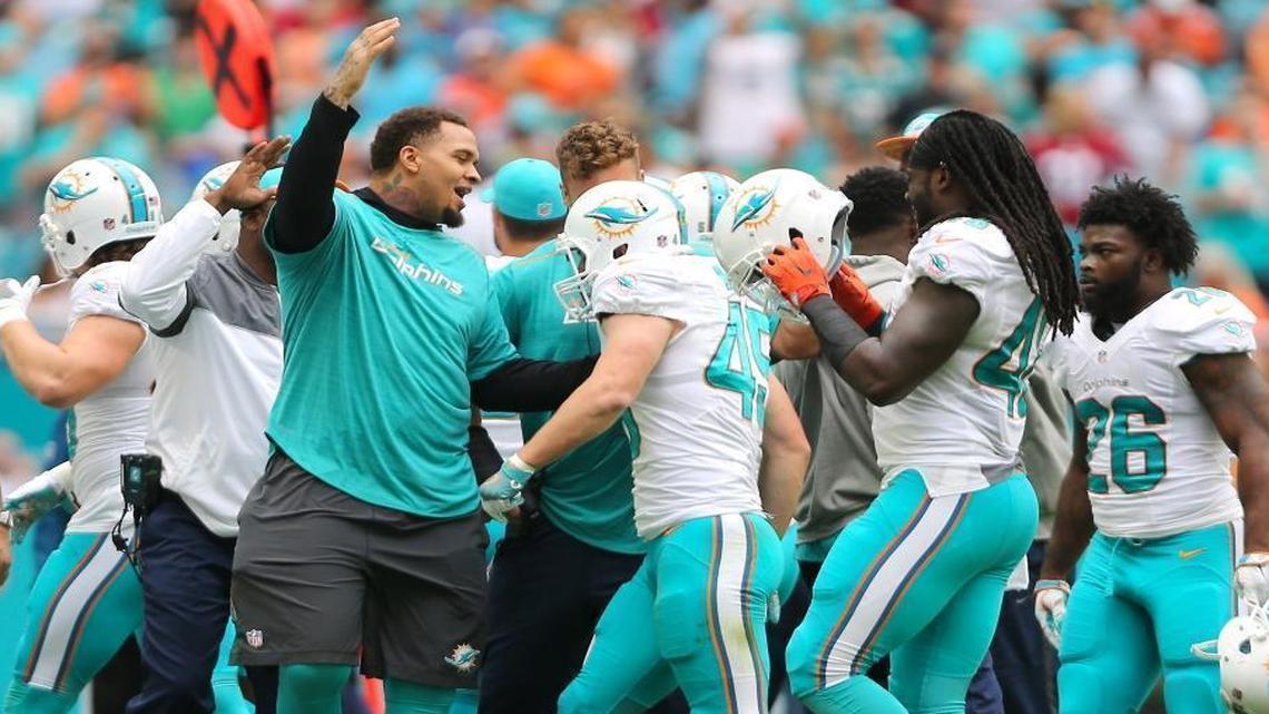 Mike Pouncey, left, is cheerleader in chief the rest of the season.