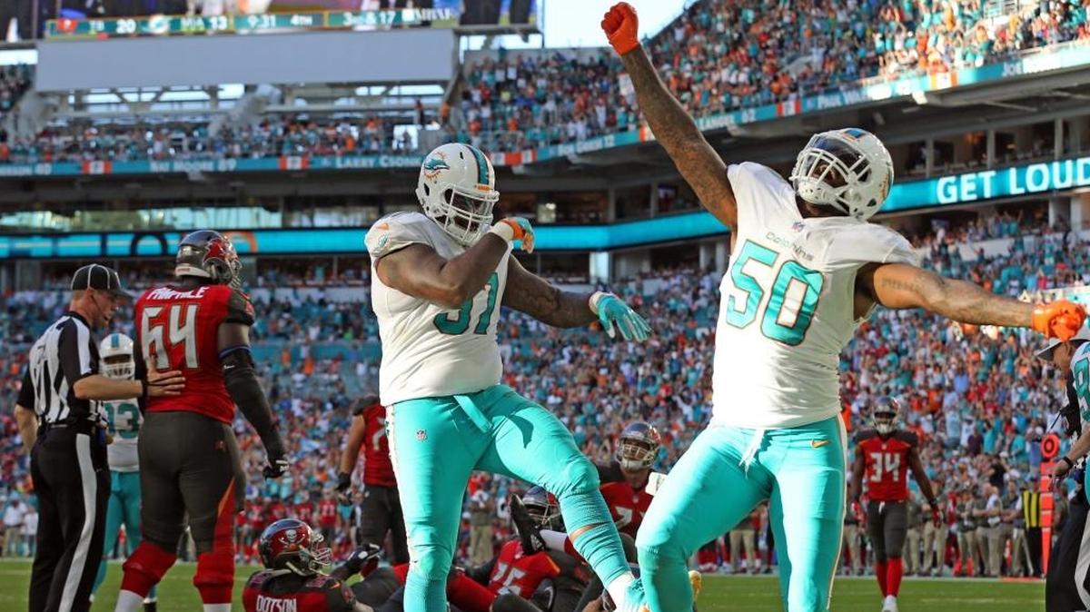 Dolphins defensive end Andre Branch, right, has been dealing with a knee injury for some time.
