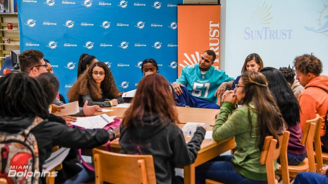 Dolphins center Mike Pouncey speaks to students at American High School about the importance of financial literacy.