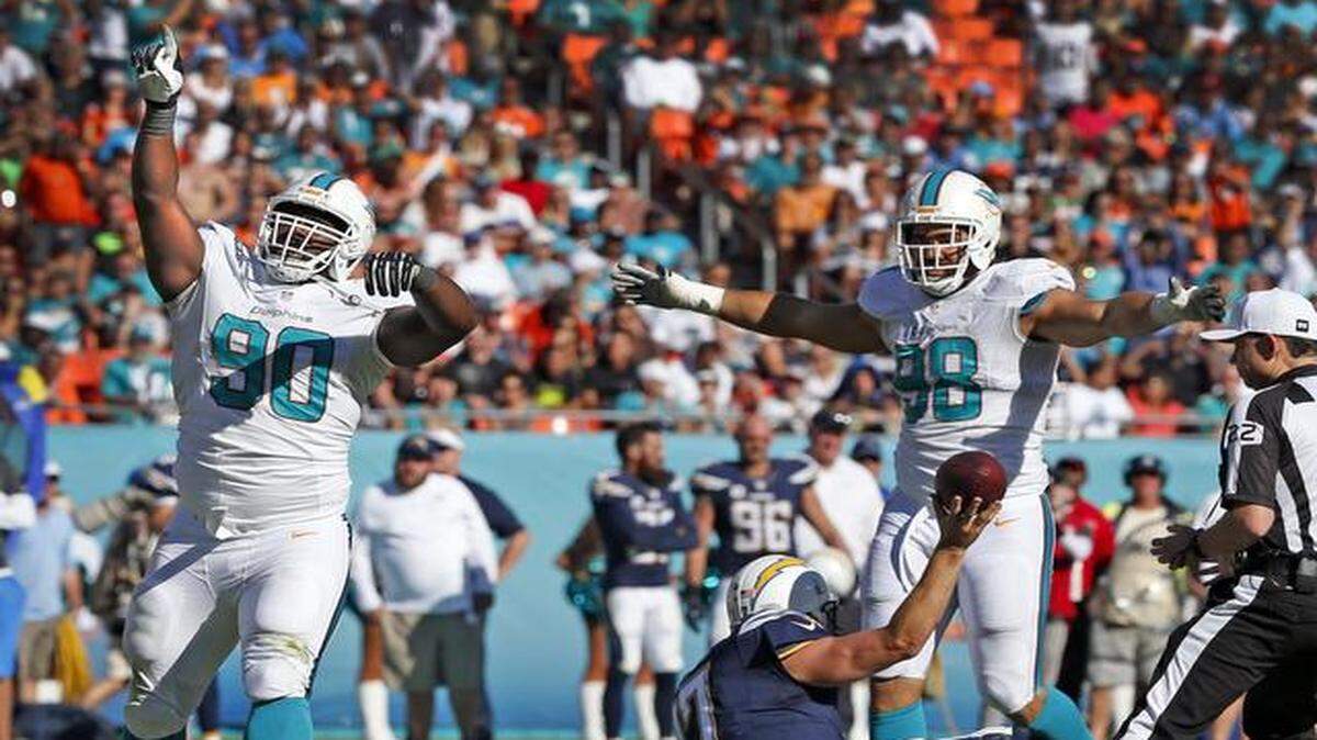 
Miami Dolphins’ Earl Mitchell celebrates after sacking San Diego Chargers quarterback in the third quarter at Sun Life Stadium in Miami Gardens, Florida, on Sunday, Nov. 2, 2014.
