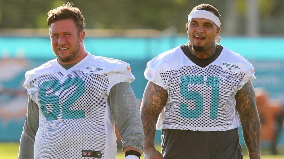 Miami Dolphins lineman Ted Larsen 62 and Mike Pouncey 51, during training camp at the Miami Dolphins training facility in Davie, Fl, July 28, 2017.