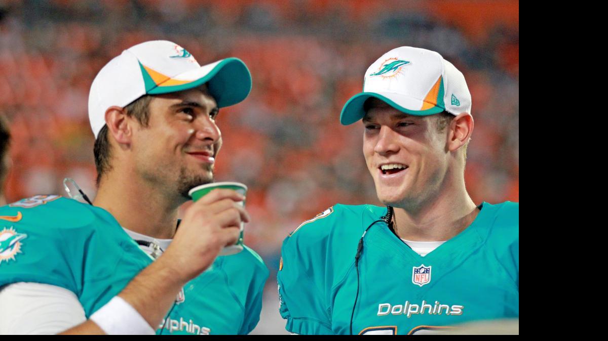 
Dolphins backup QB Matt Moore, left, says he has never talked to the team’s equipment managers about the inflation level of his footballs. “They do their job and we go play,” Moore says. 
