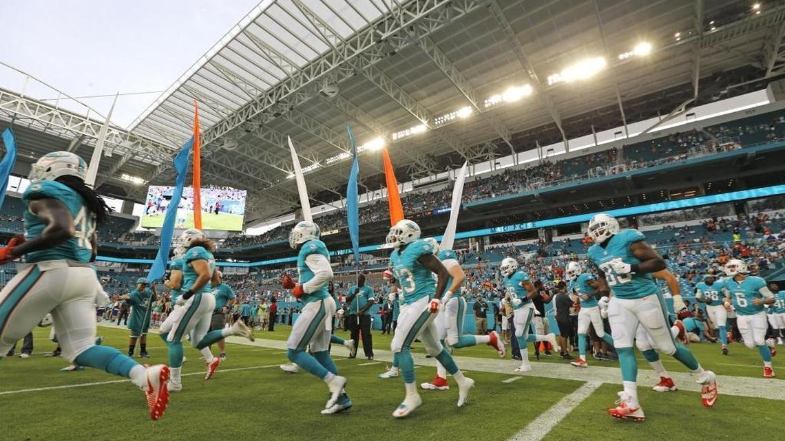 The Dolphins rush the field as the Miami Dolphins host the Tennessee Titans at Hard Rock Stadium on Thursday, September 1, 2016.